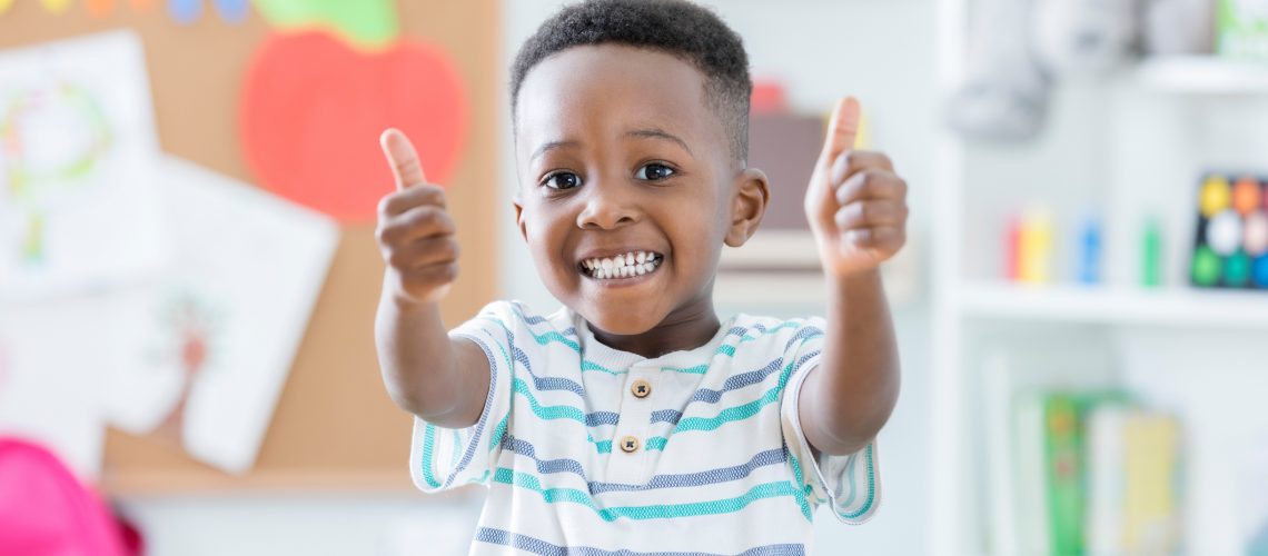 Adorable boy gives thumbs up at RNS Academy